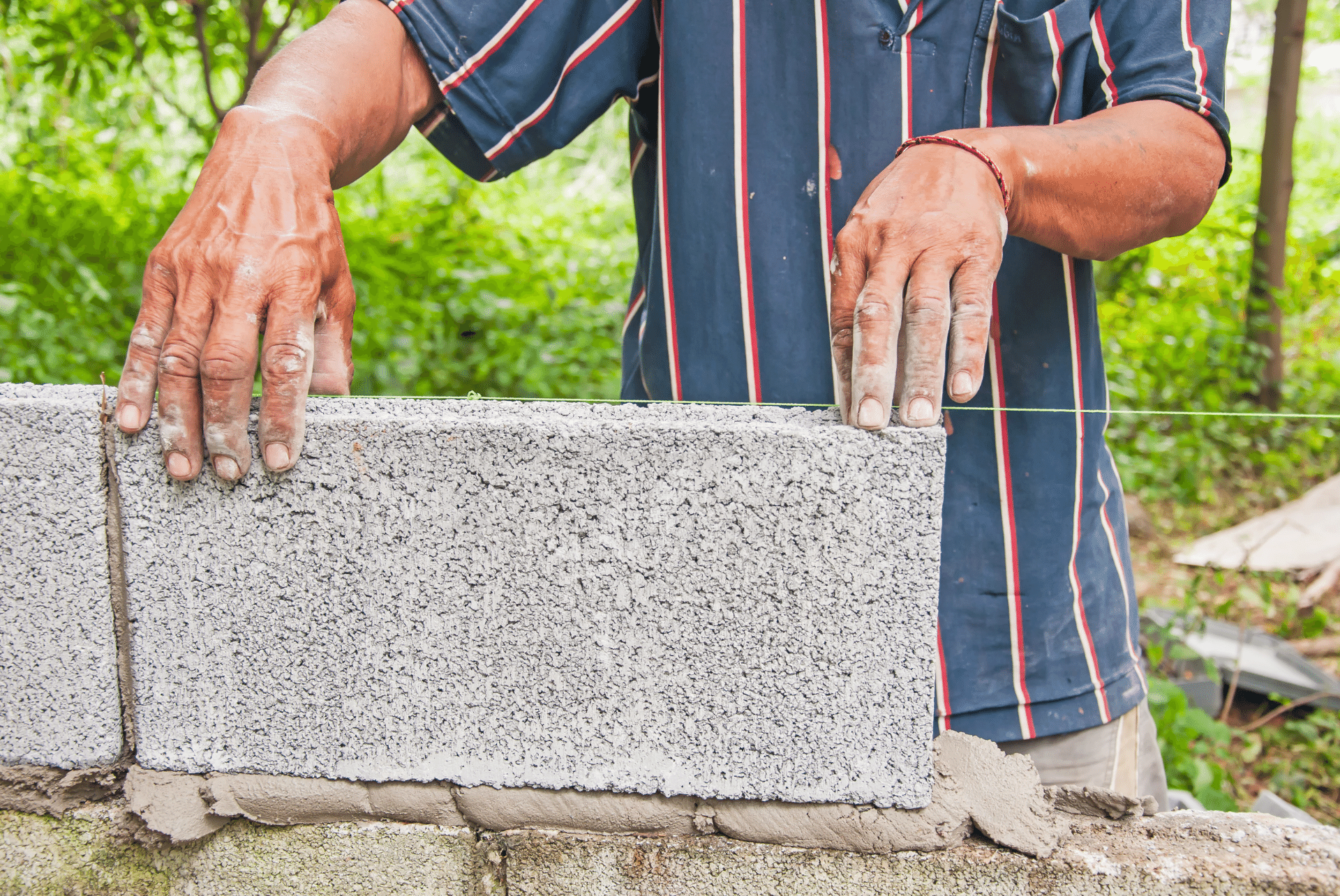setting a concrete block in place